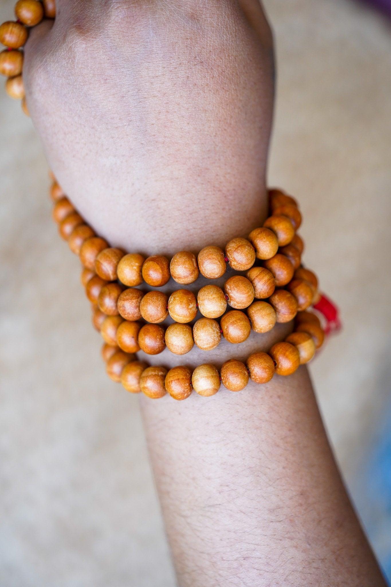 108 Beads Sandalwood Mala in wrist 