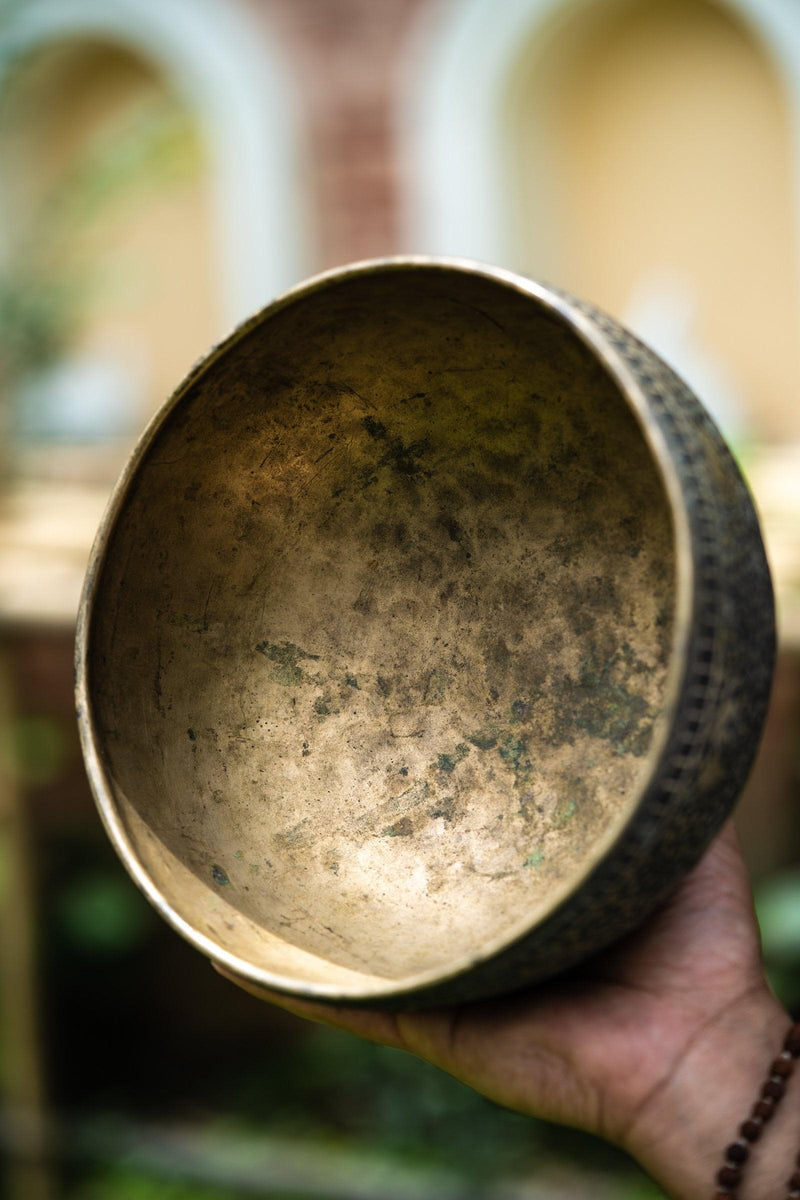 Authentic antique jaambati singing bowl with detail carving of animals from Nepal