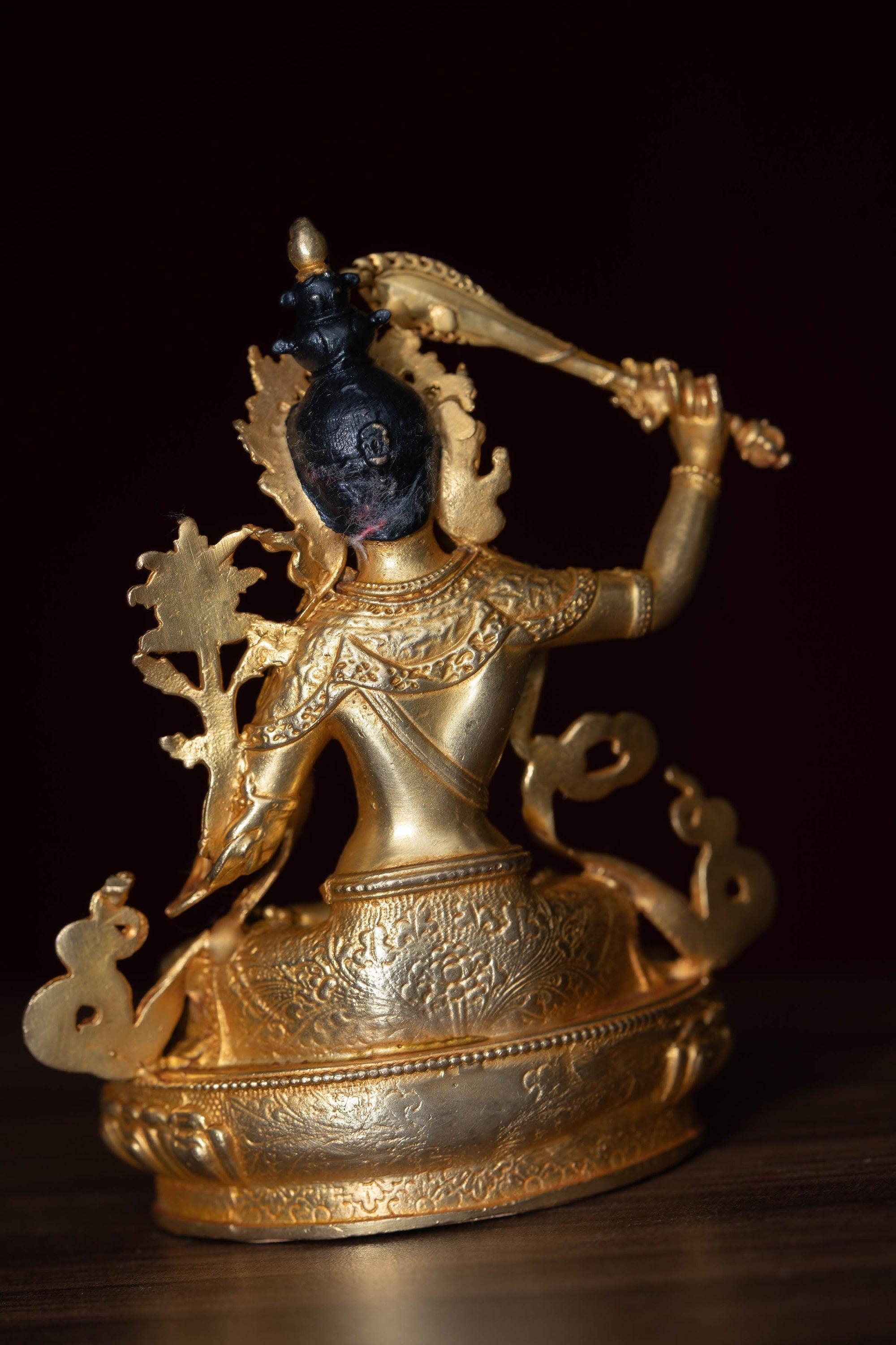Manjushri Statue gold plated in small size -4 inch.