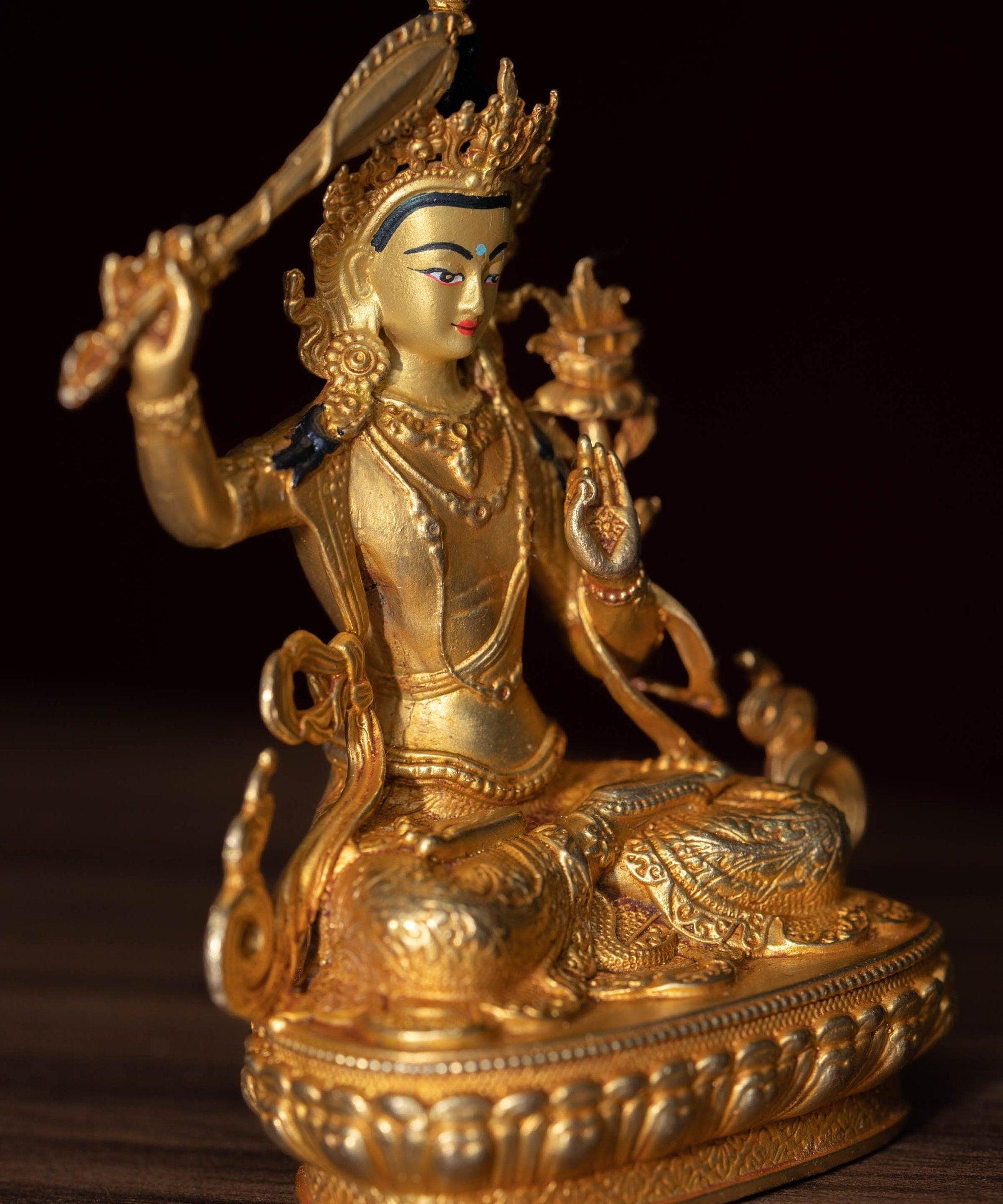 Manjushri Statue gold plated in small size -4 inch.