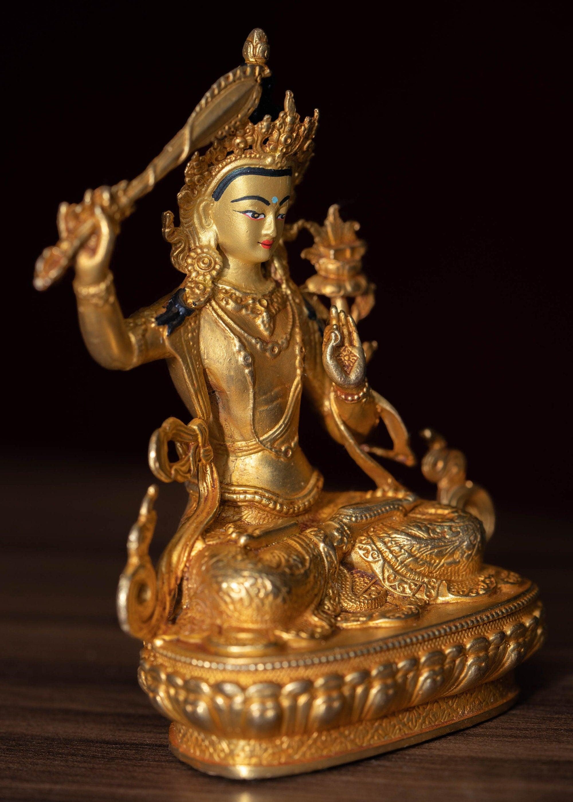 Manjushri Statue gold plated in small size -4 inch.