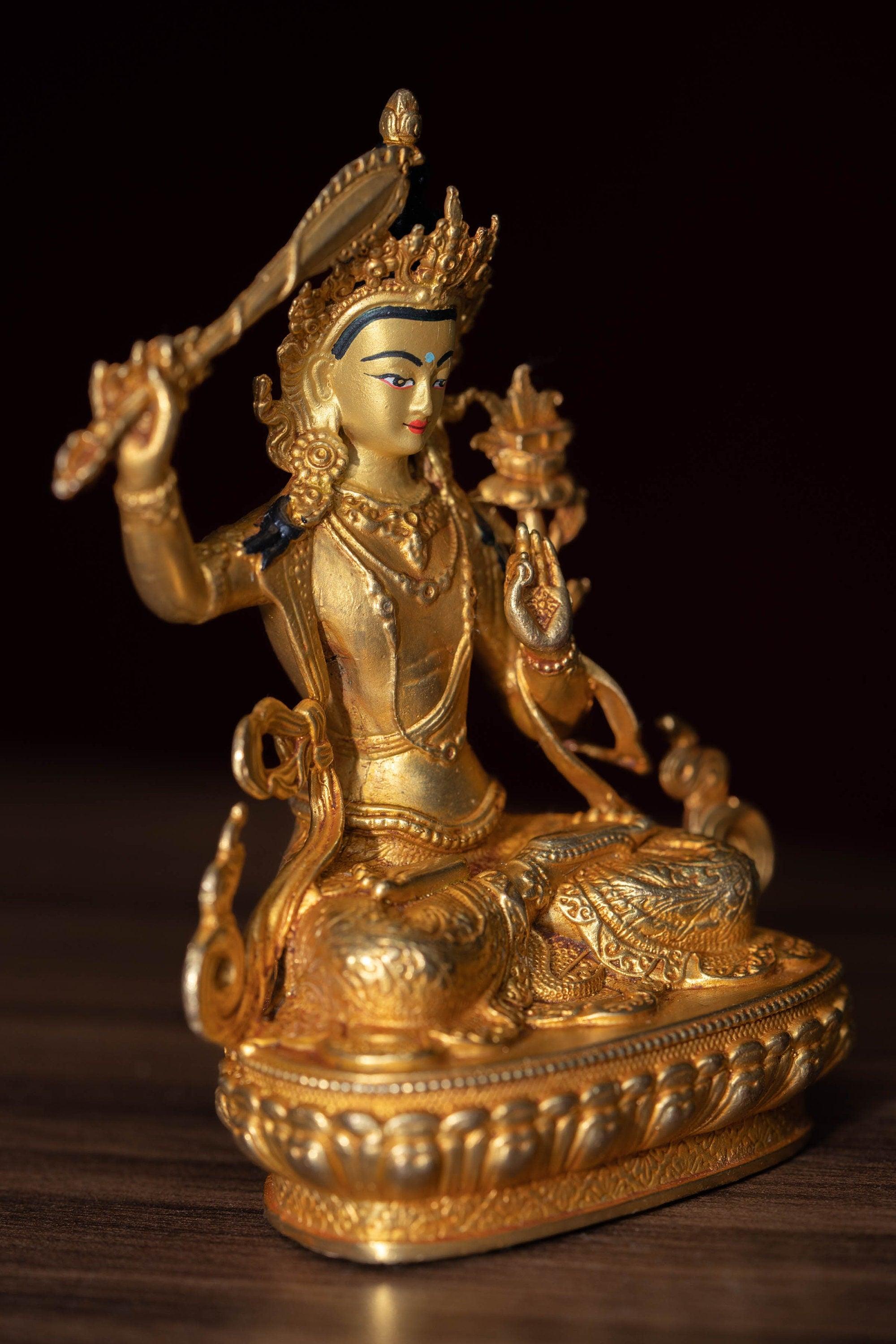 Manjushri Statue gold plated in small size -4 inch.