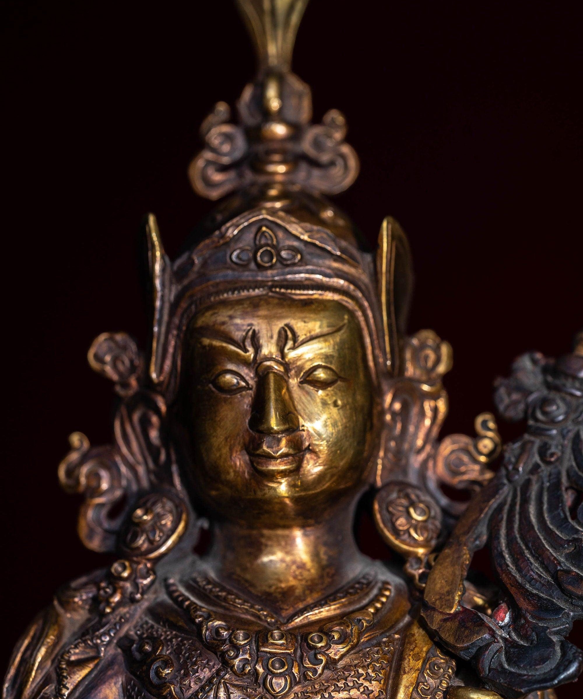 Guru Rinpoche statue metal craft from Nepal . Padmasambhava on lotus with bajra and skull cup