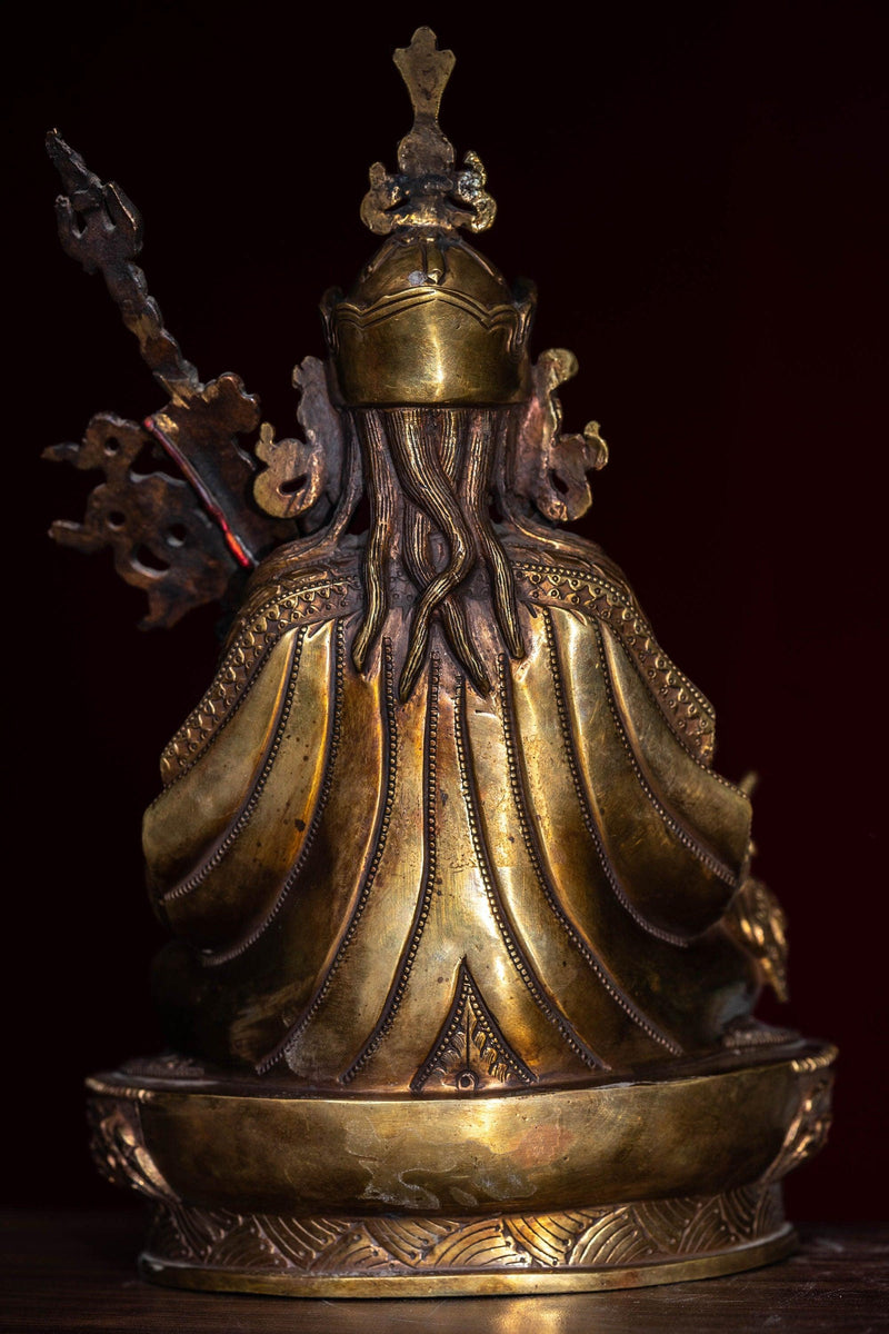 Guru Rinpoche statue metal craft from Nepal . Padmasambhava on lotus with bajra and skull cup