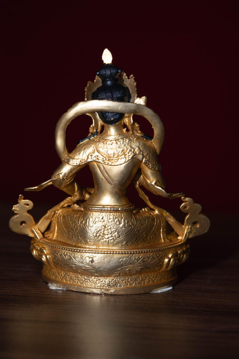 Vajrasattva holds the Vajra in his hand and seated on lotus. This is gold plated small size statue of Buddhist deity