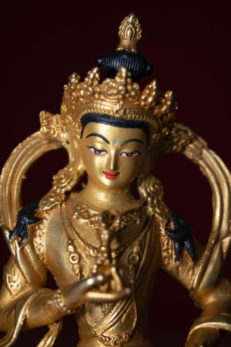 Vajrasattva holds the Vajra in his hand and seated on lotus. This is gold plated small size statue of Buddhist deity