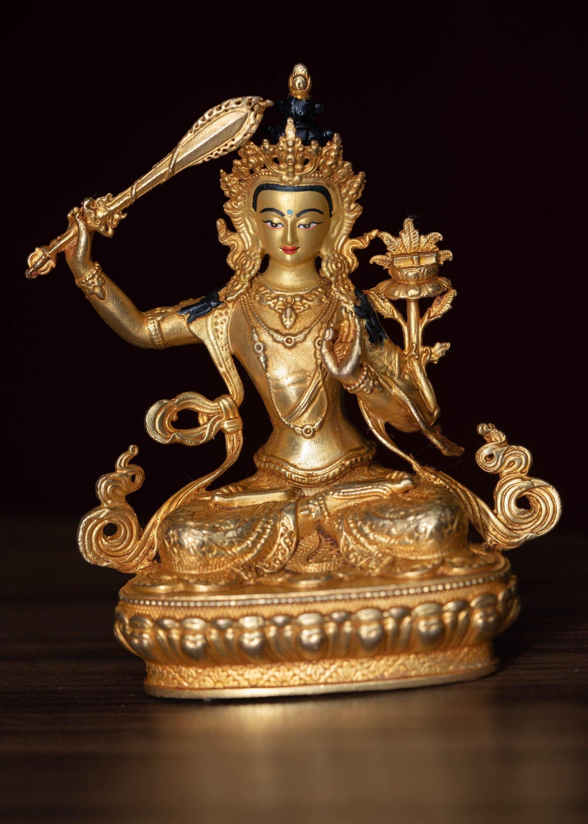 Manjushri Statue gold plated in small size -4 inch.