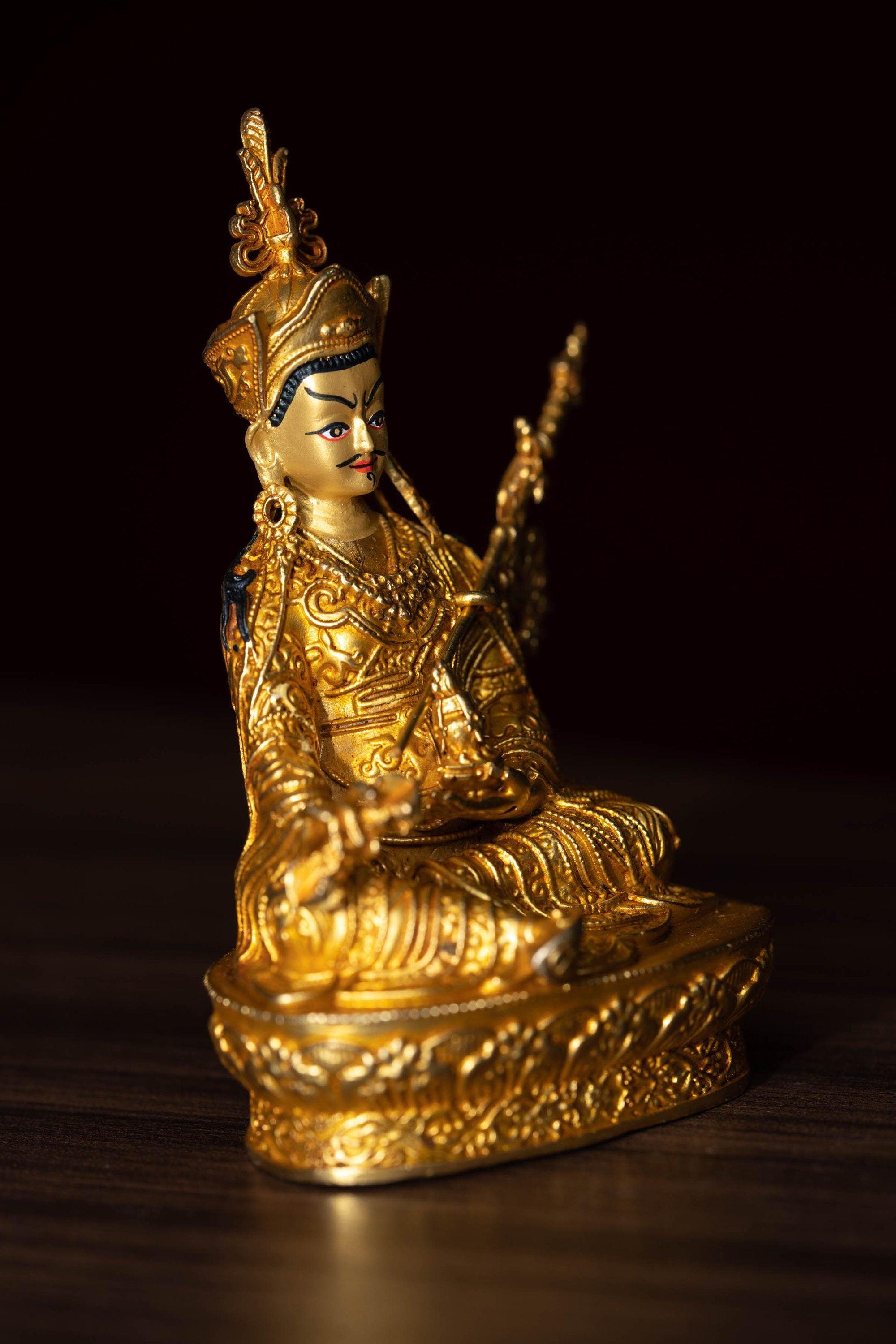 mall size 4 inch Guru Padmasambhava is gold plated on metal.