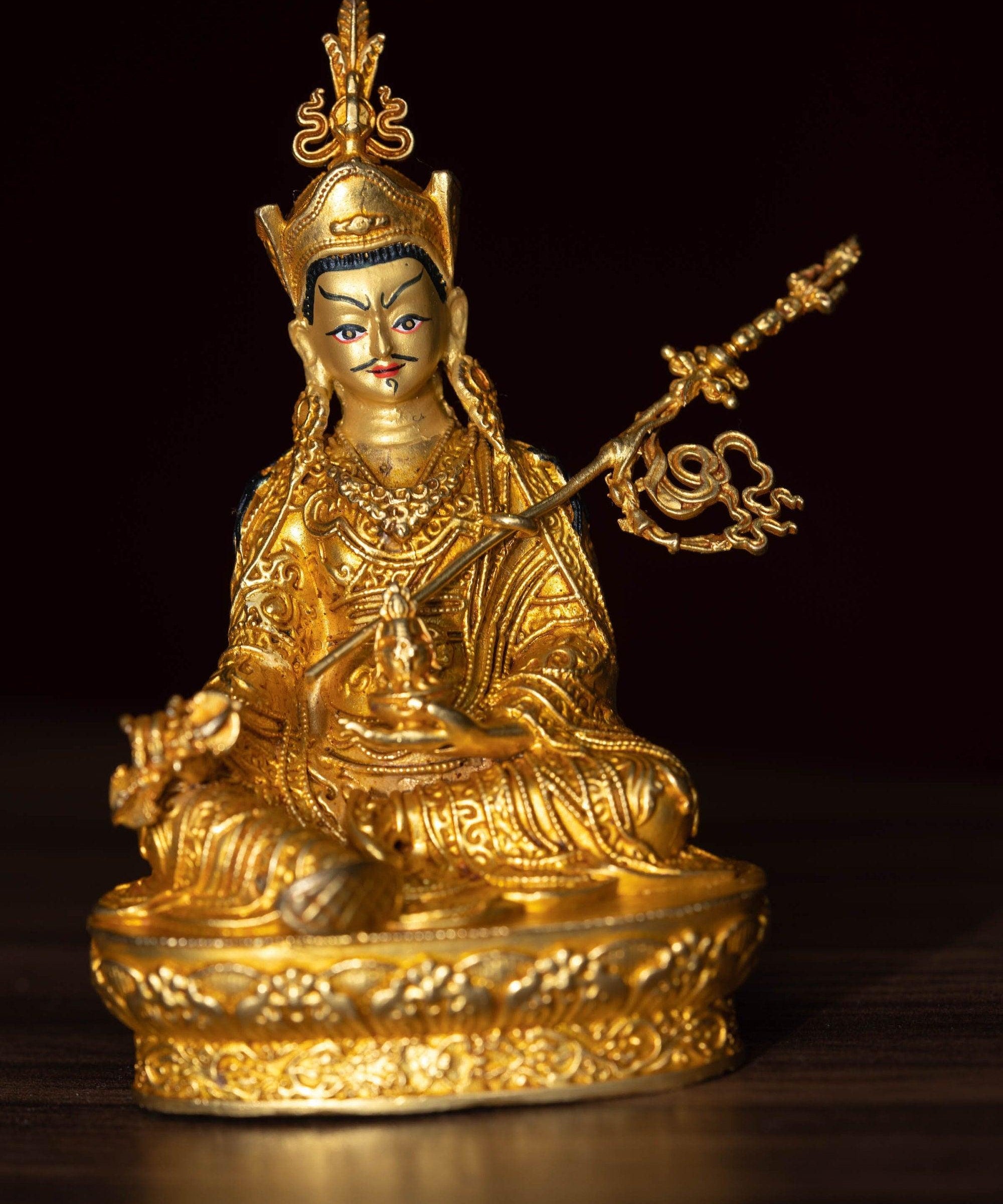 Small size 4 inch Guru Padmasambhava is gold plated on metal.