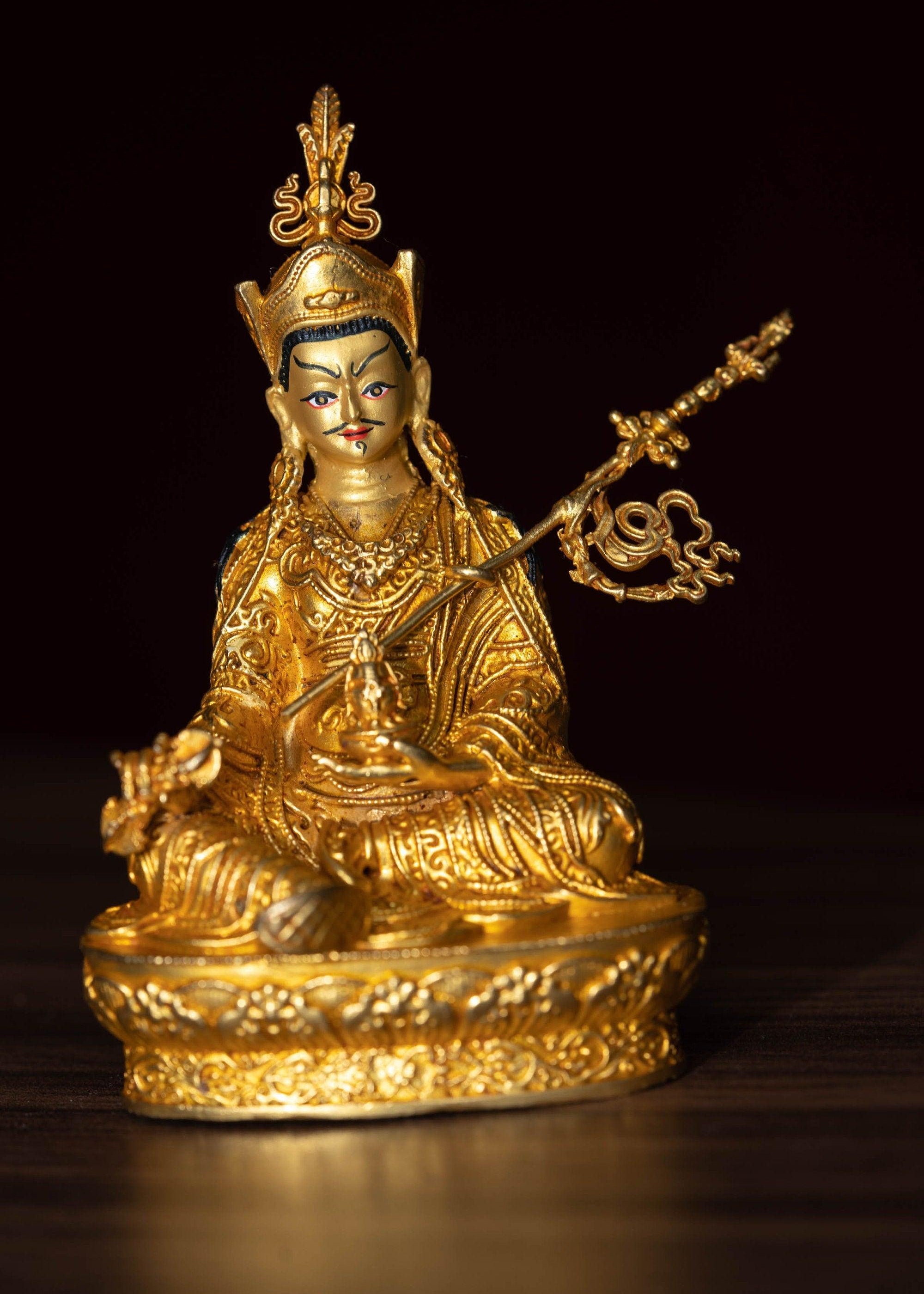 Small size 4 inch Guru Padmasambhava is gold plated on metal.