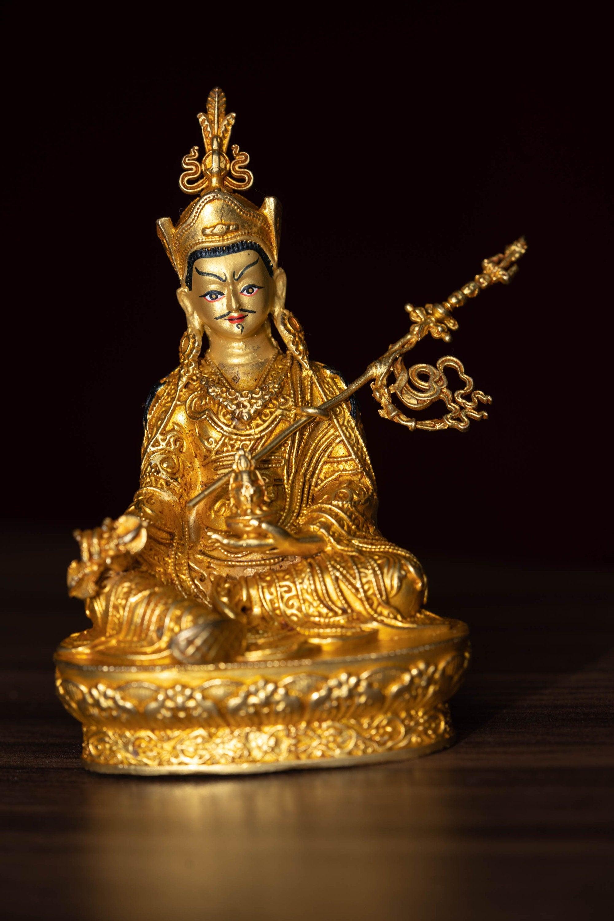 Small size 4 inch Guru Padmasambhava is gold plated on metal.
