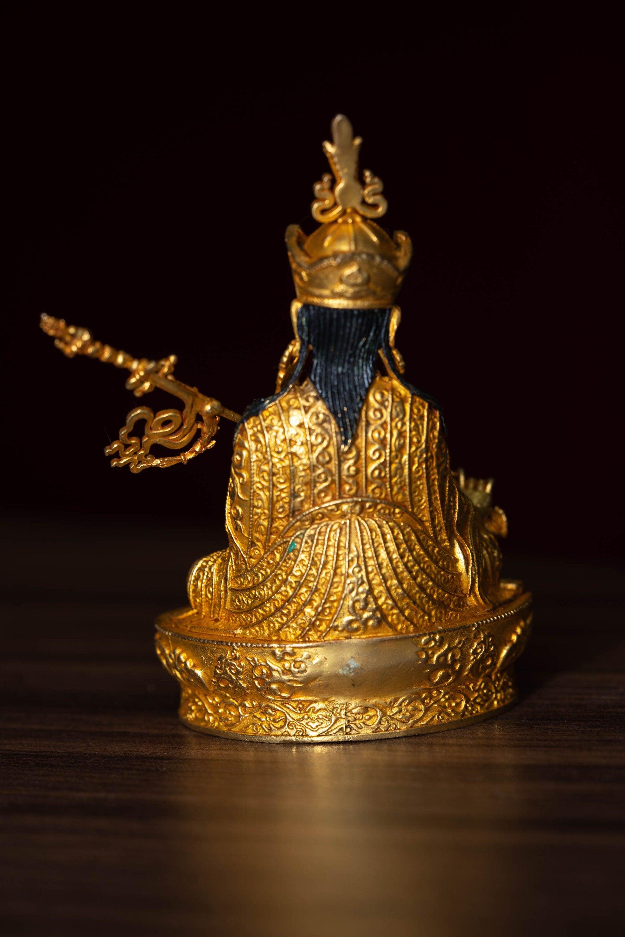 mall size 4 inch Guru Padmasambhava is gold plated on metal.