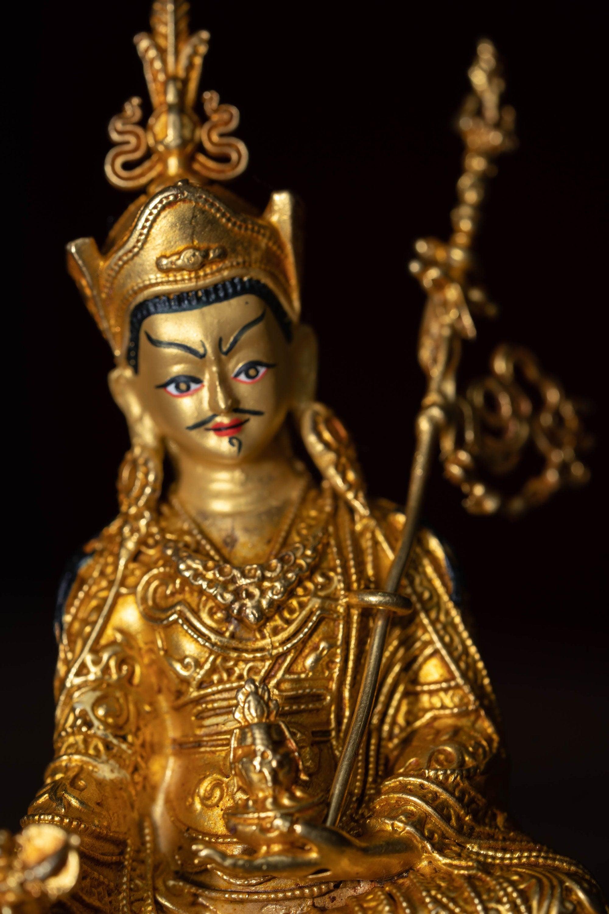 mall size 4 inch Guru Padmasambhava is gold plated on metal.