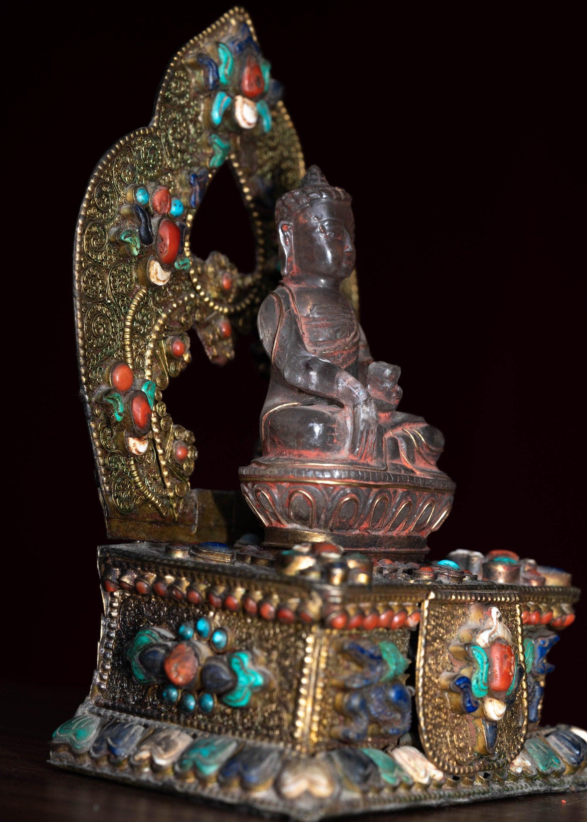 Crystal Statue of Buddha with Metal craft gold plated throne with ruby , turquoise and lapis