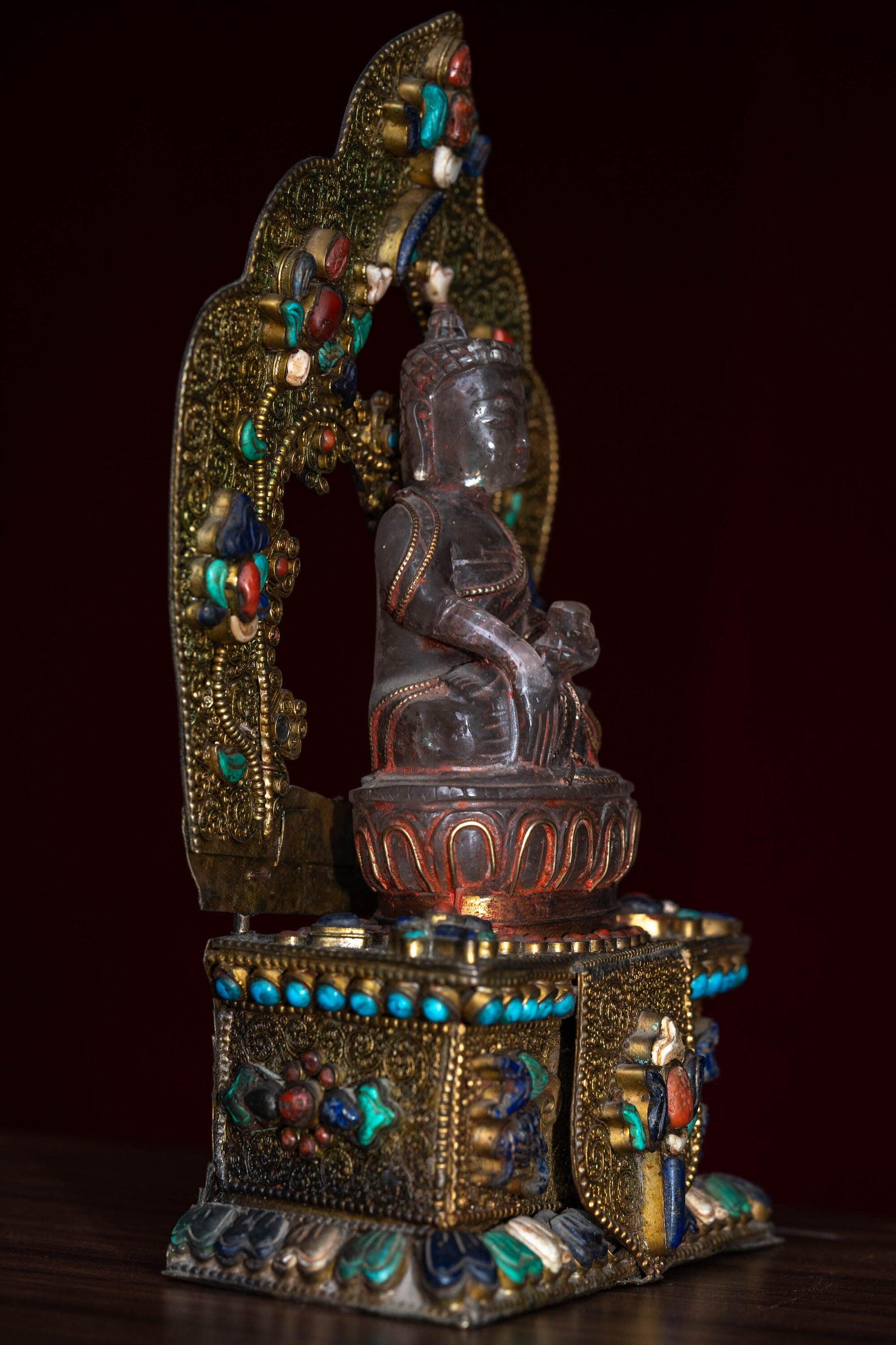 Crystal Statue of Buddha with Metal craft gold plated throne with ruby , turquoise and lapis