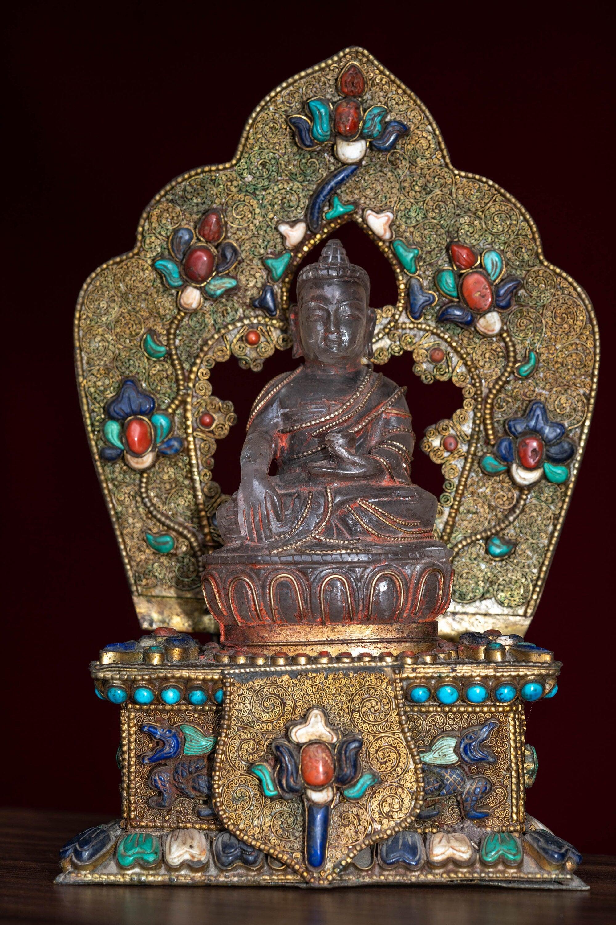 Crystal Statue of Buddha with Metal craft gold plated throne with ruby , turquoise and lapis