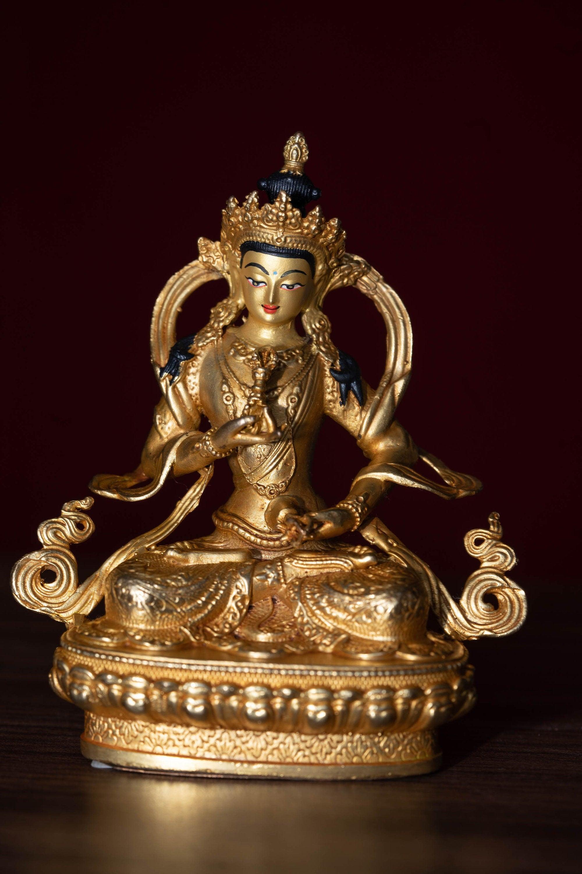 Vajrasattva holds the Vajra in his hand and seated on lotus. This is gold plated small size statue of Buddhist deity