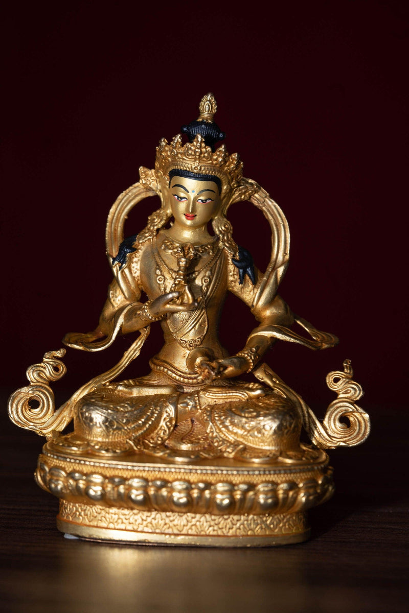 Vajrasattva holds the Vajra in his hand and seated on lotus. This is gold plated small size statue of Buddhist deity