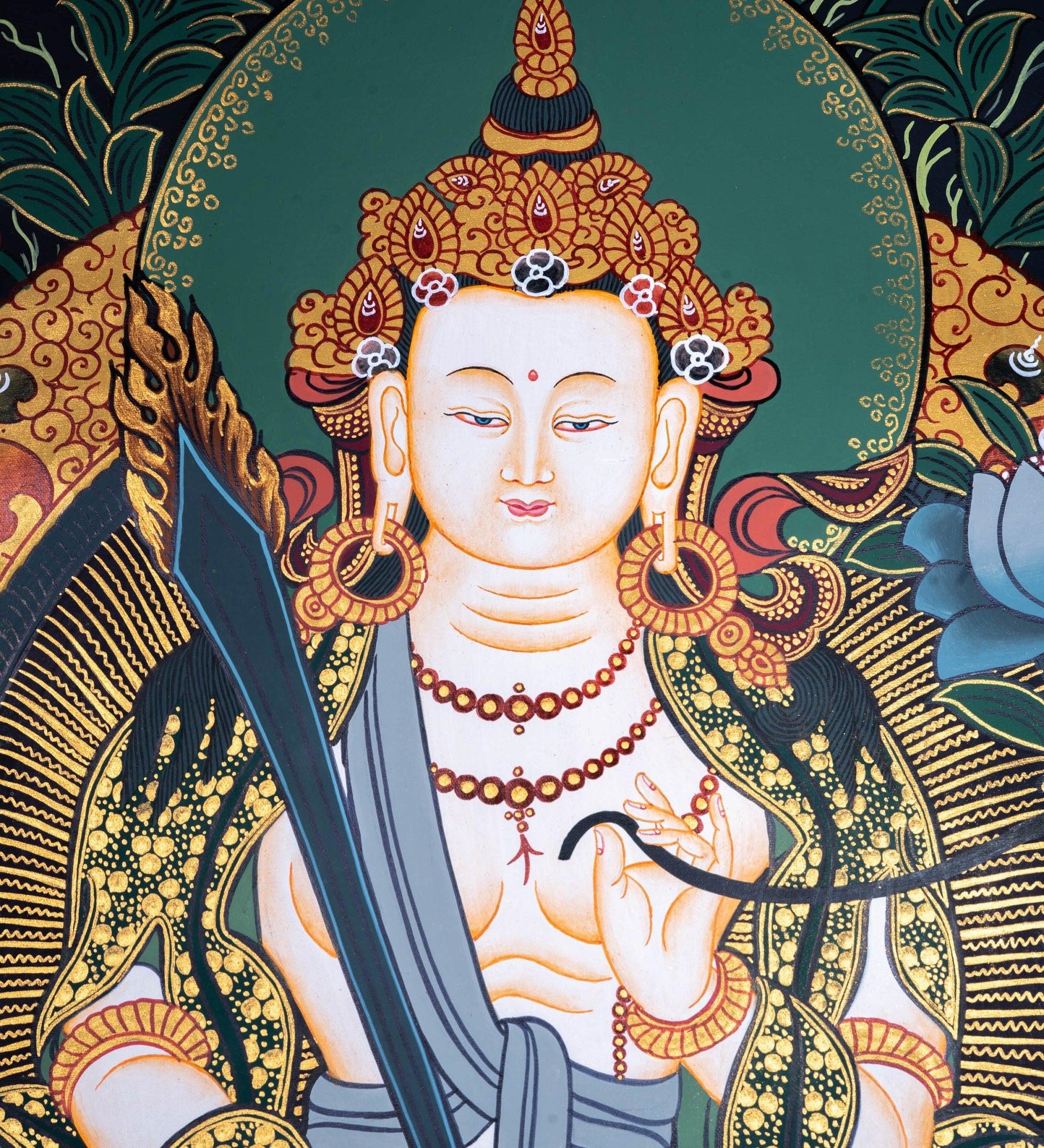 Manjushri Thangka painting in Chinese Art . Buddha of Wisdom and  cutting ignorance with his sword of flames.
