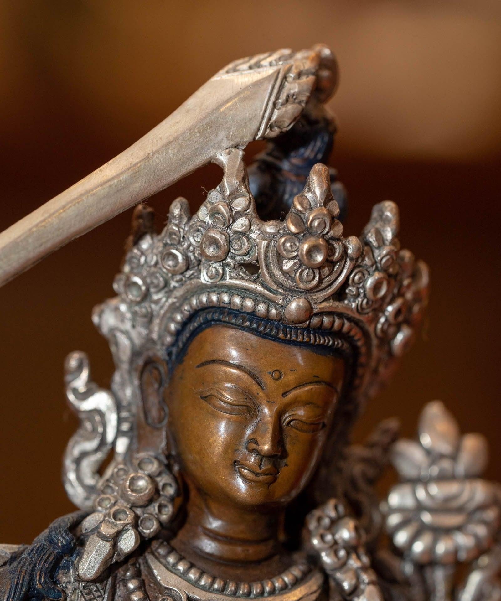  Small copper gilt statue of Manjushri  with silver plated