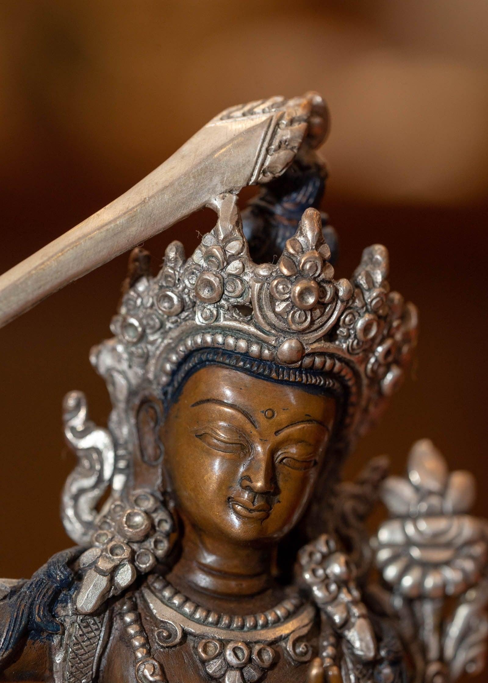  Small copper gilt statue of Manjushri  with silver plated