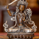  Small copper gilt statue of Manjushri  with silver plated