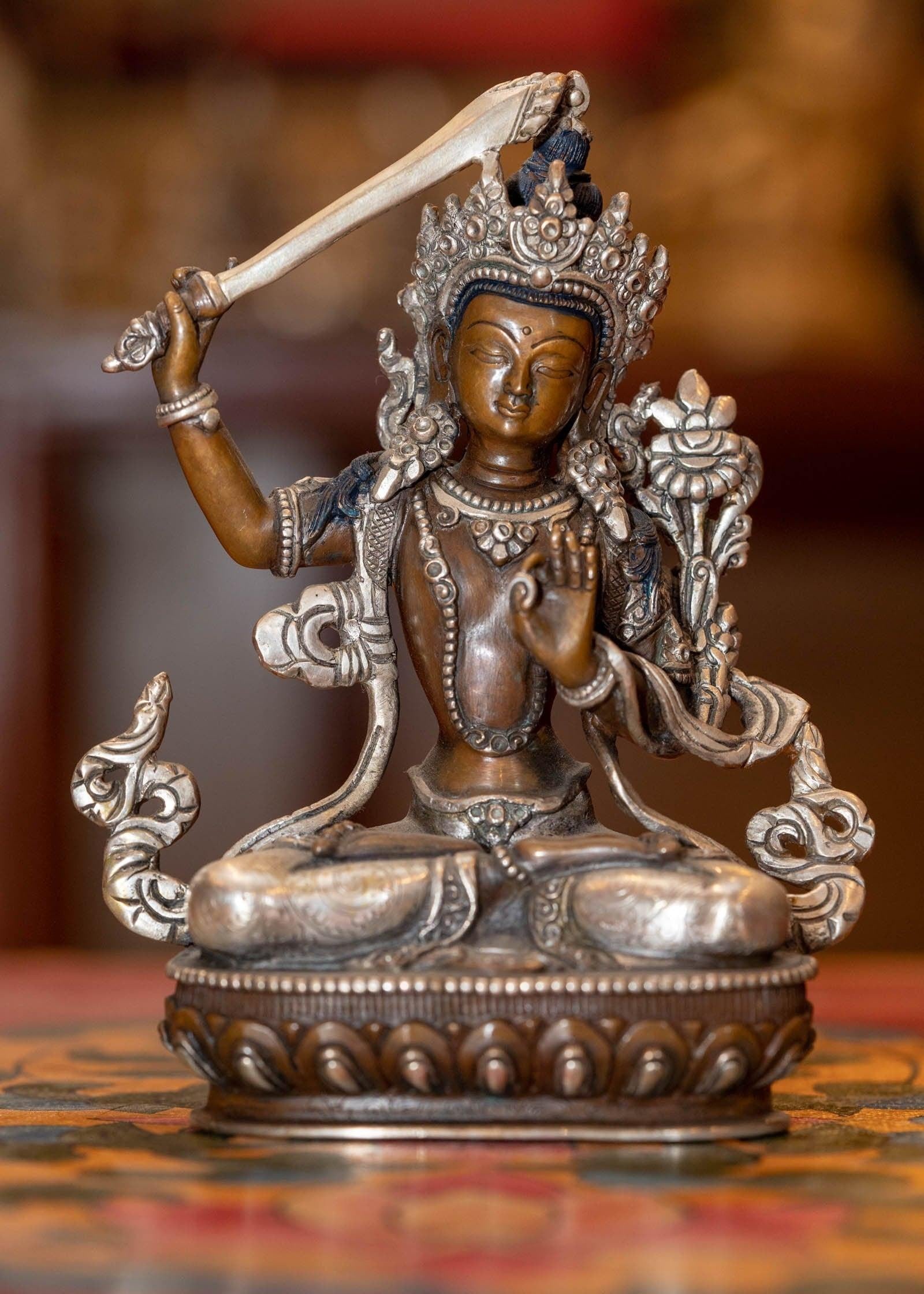  Small copper gilt statue of Manjushri  with silver plated