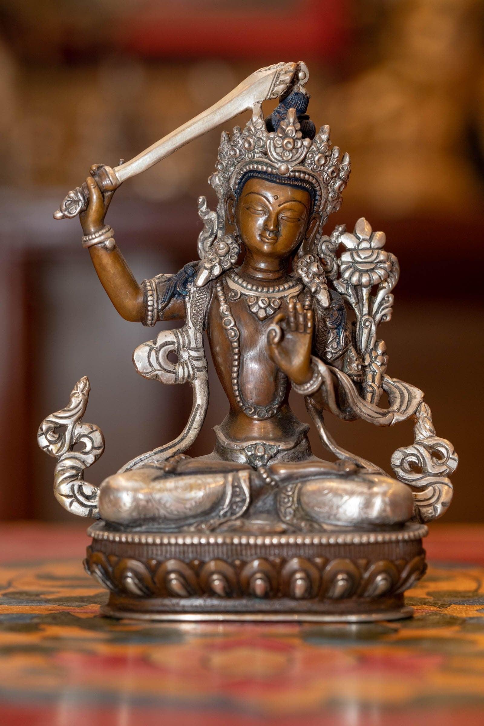  Small copper gilt statue of Manjushri  with silver plated