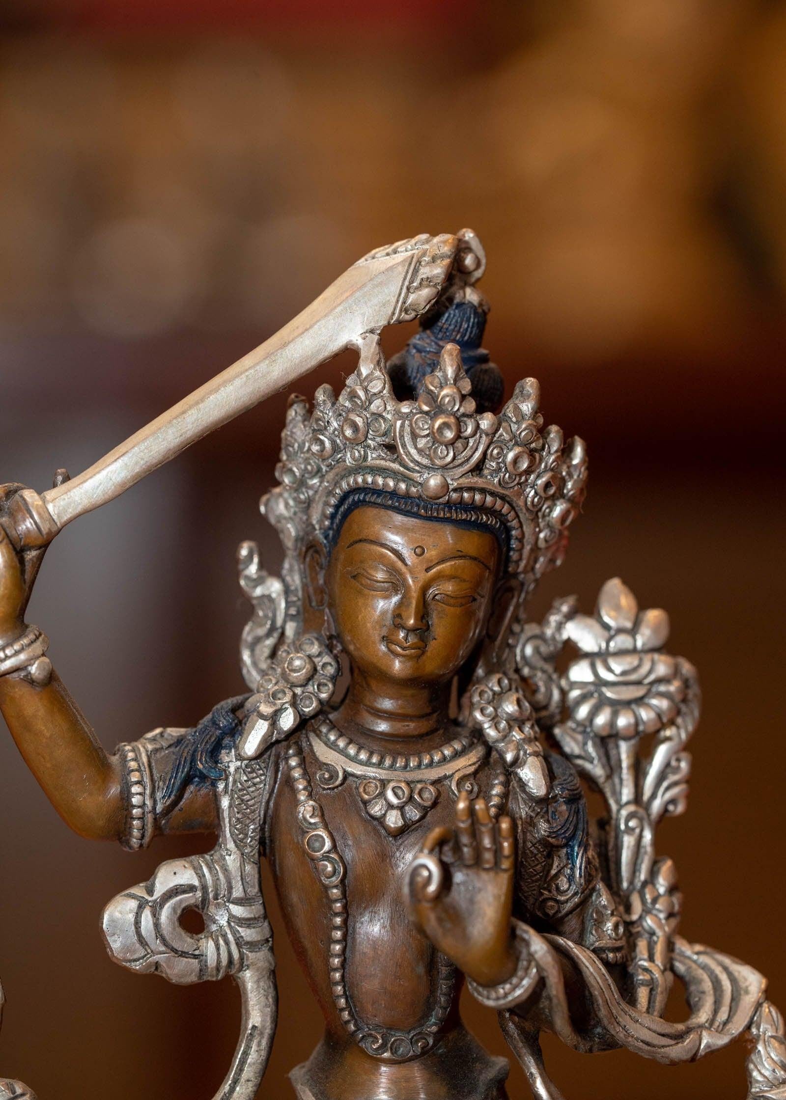  Small copper gilt statue of Manjushri  with silver plated