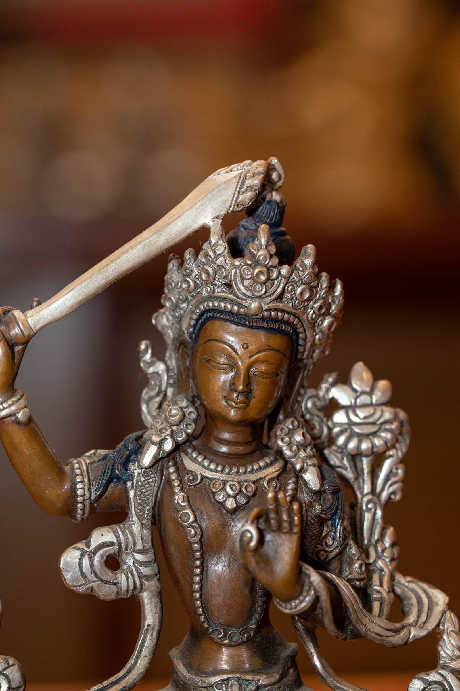  Small copper gilt statue of Manjushri  with silver plated