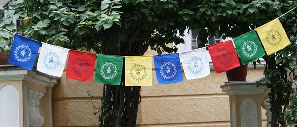 Om Praying Flag being hung